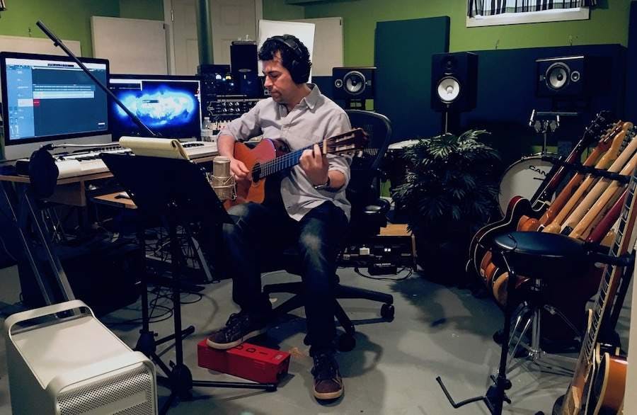 Gregg Fine recording guitar in studio